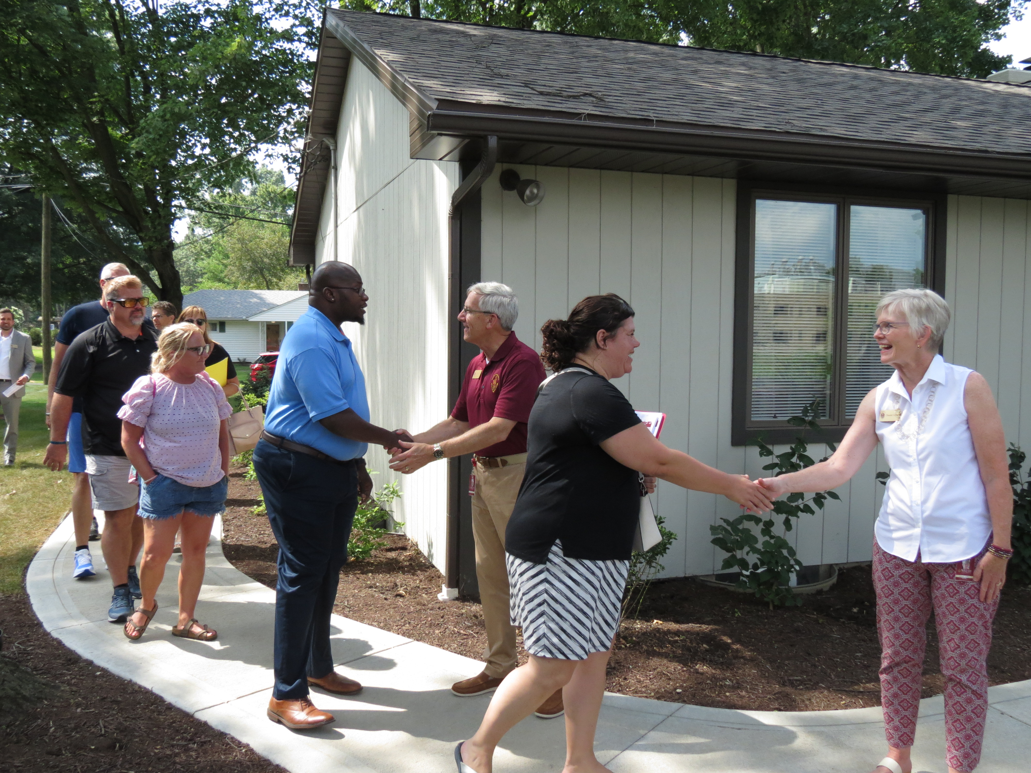 photo: President and Mrs. Collins greeting parents at the Cav House
