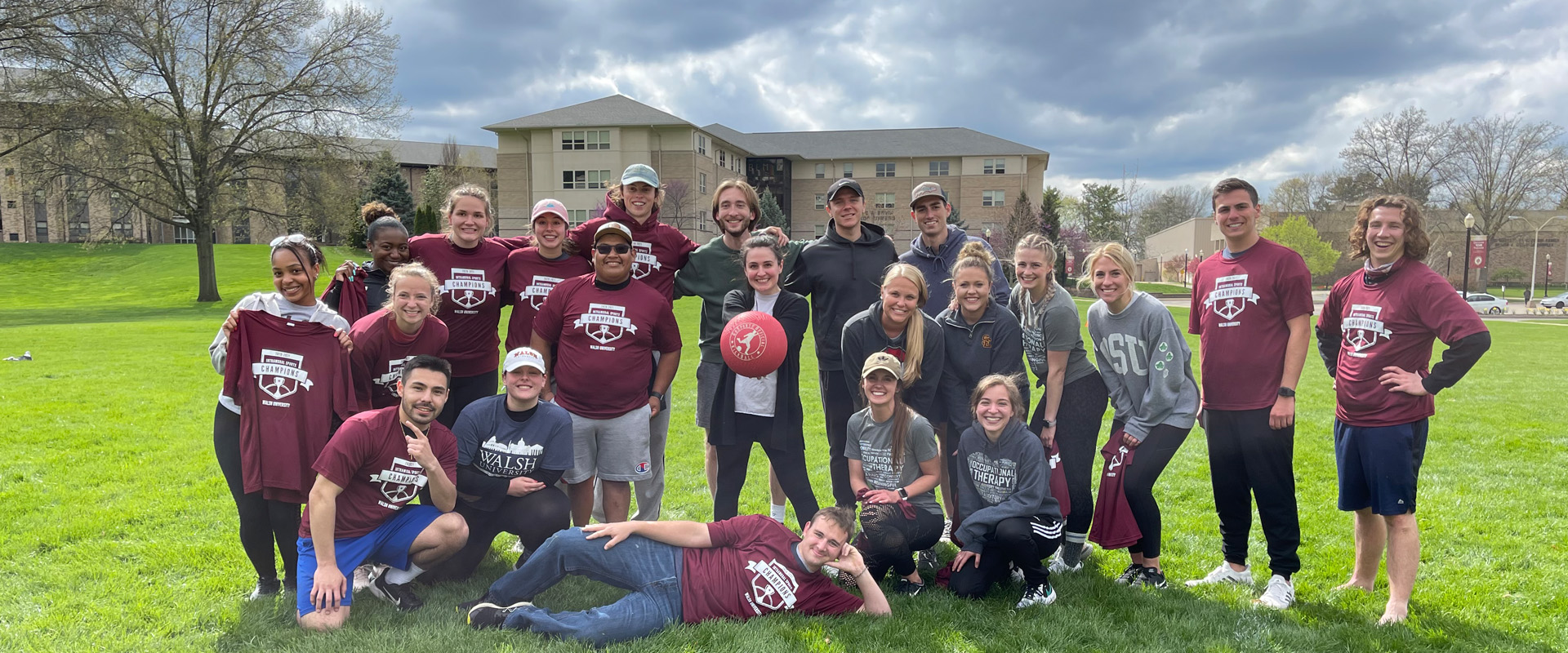 group photo of Walsh student intramural kickball team