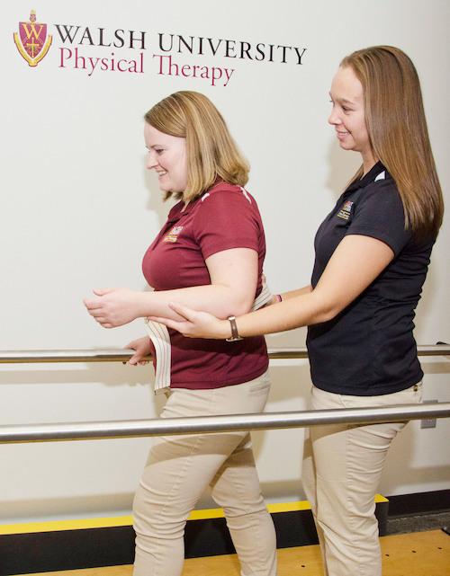 photo of DPT students practicing an assisted walking exercise