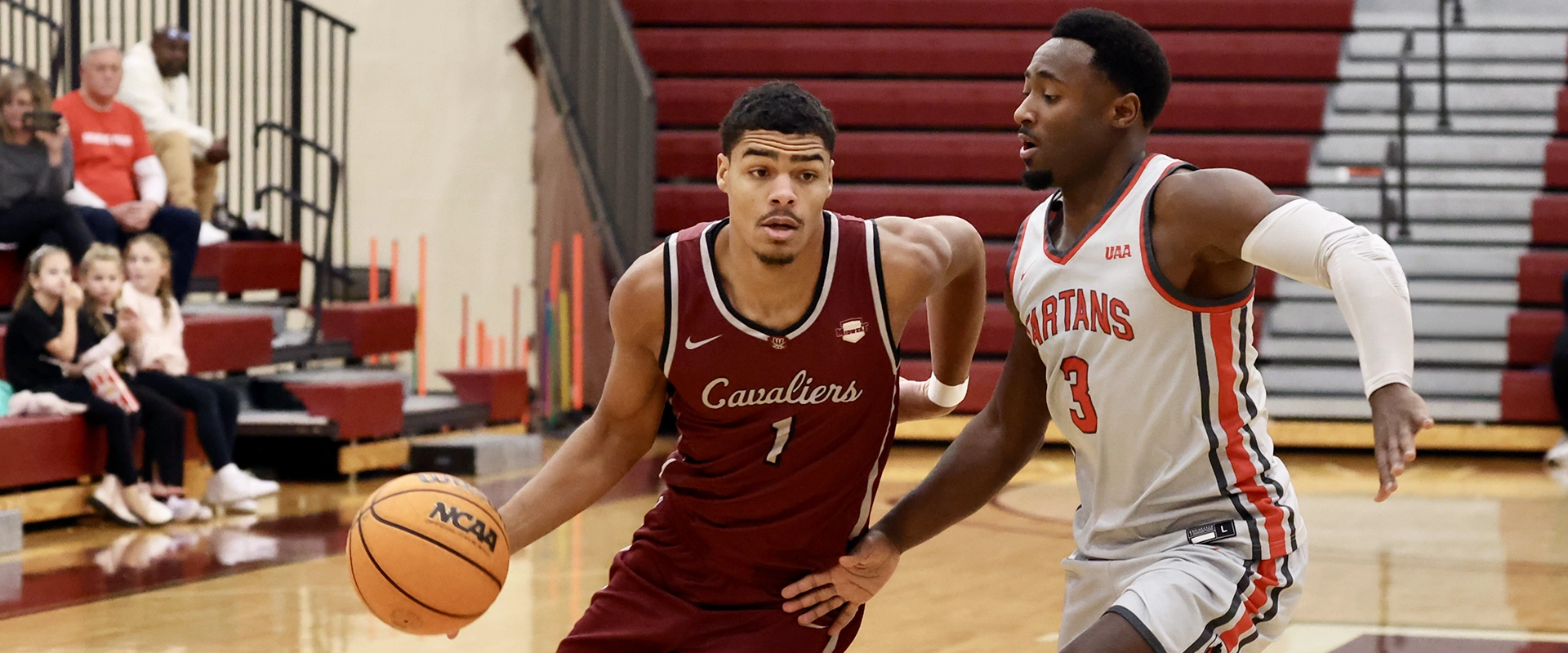 Walsh University men’s basketball player dribbles past a defender during a home game.