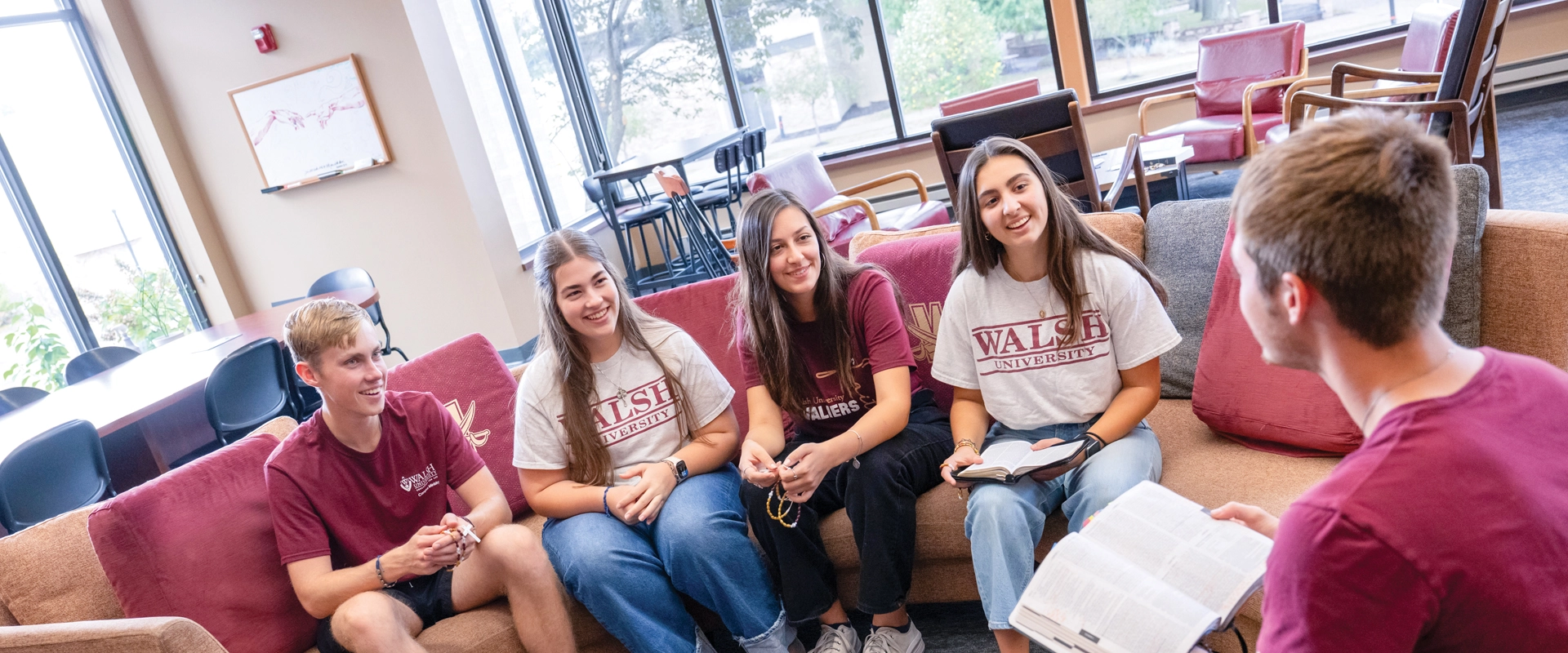 A group of students during a Bible Study session in the new Campus Ministry Lounge at Walsh University