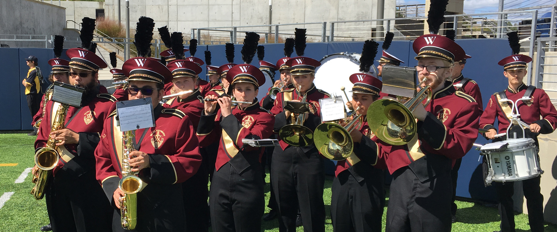 photo of the Walsh marching band performing at a football game