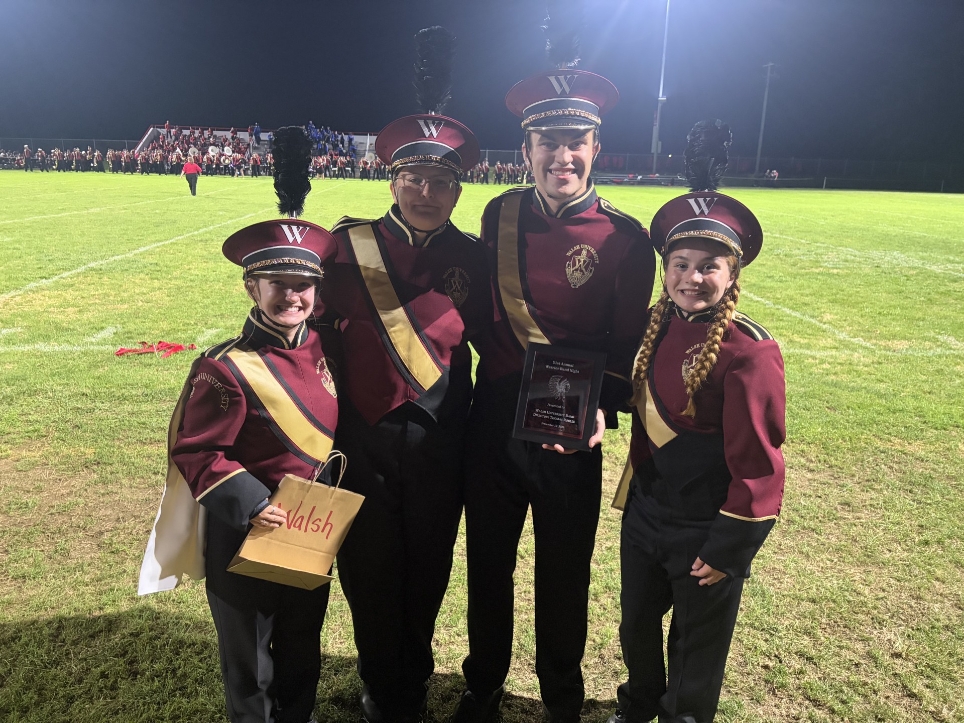 Band member with award at Edgewood.