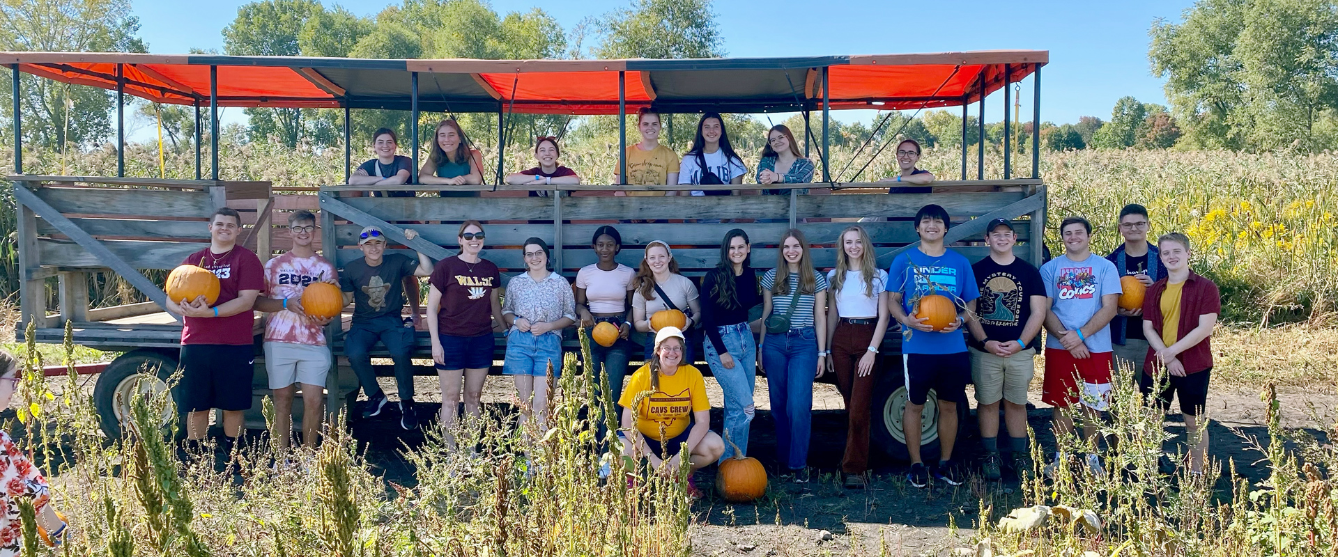 photo of Honors Program students participating in a hayride at a pumpkin patch