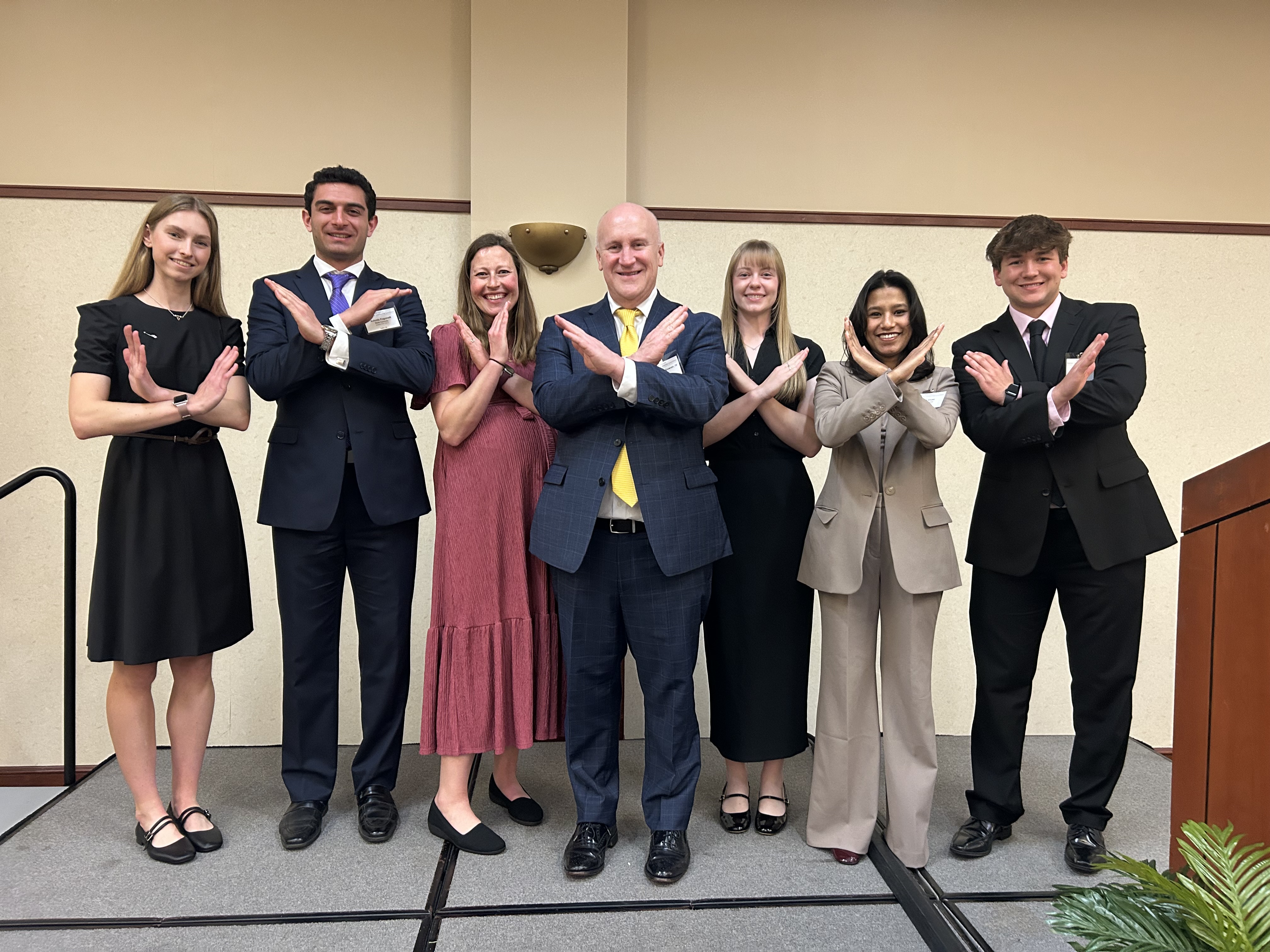 Business Club Members pose with Thomas McGowan at the 55th Business Club Scholarship Luncheon