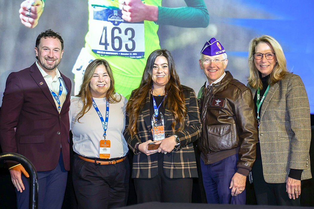 Walsh leadership accepts the DII Award of Excellence