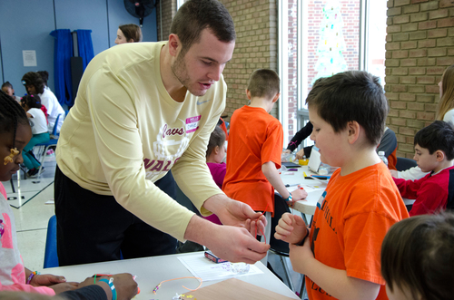 Football Players volunteer at the North Canton YMCA
