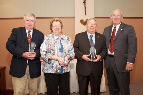 Outstanding Alumni: Larry Clark '72, Virginia Neutzling '83, James McPartlin '67 and President Richard Jusseaume.