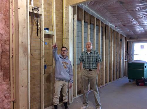 Brother Walter and Andrew Chawlik inspect the new building which will be ready for occupancy in July.